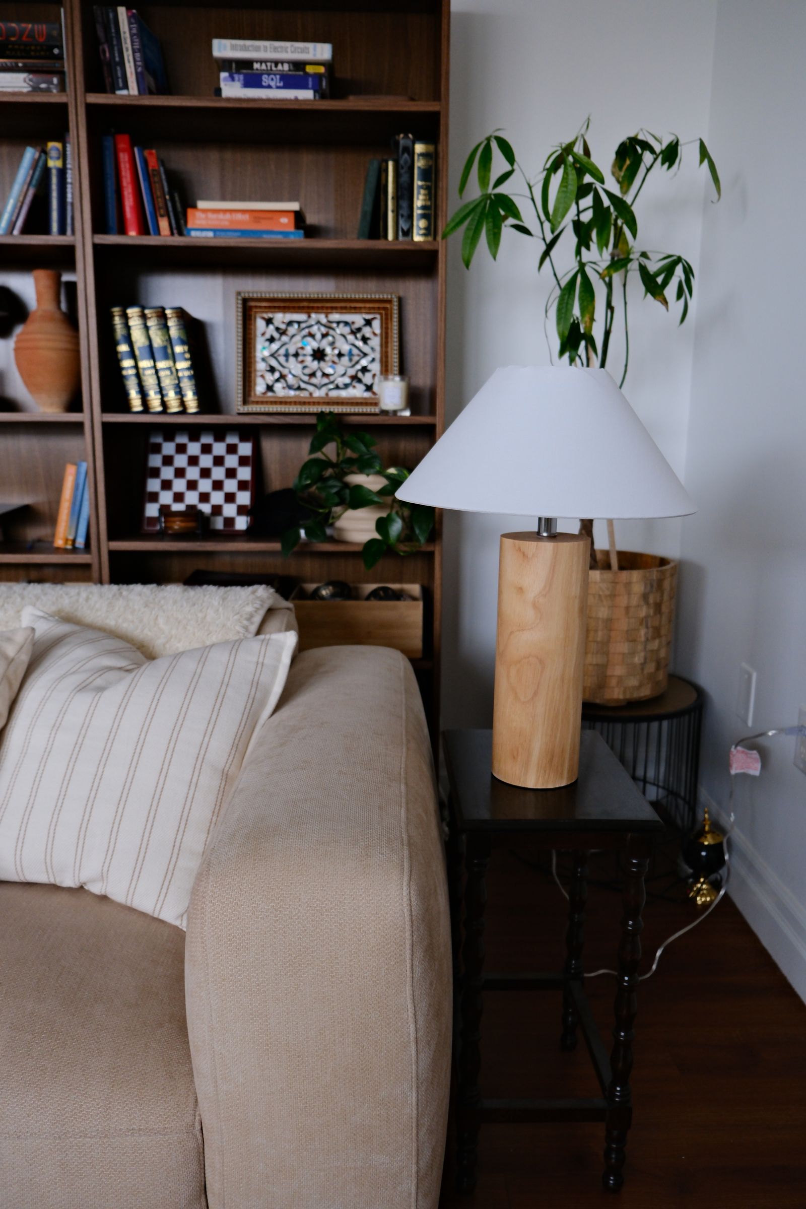 Shihnoo wooden table lamp with natural hevea wood base and lit linen shade
